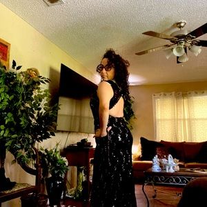 Formal dress  and smoke free home. worn 1X material is Lacey with silver sequins